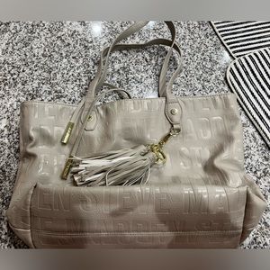 Very beautiful purse!! Steve Madden cream and gold bag!